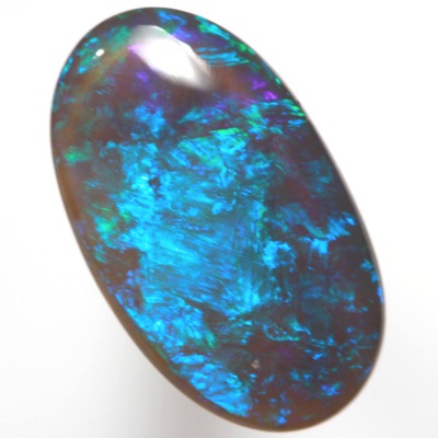 SOLID BLACK CRYSTAL OPAL Rolling flashes of green and turquoise purple fire